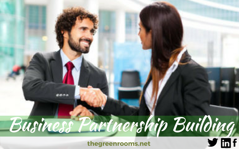 shaking hands to form Business Partnership
