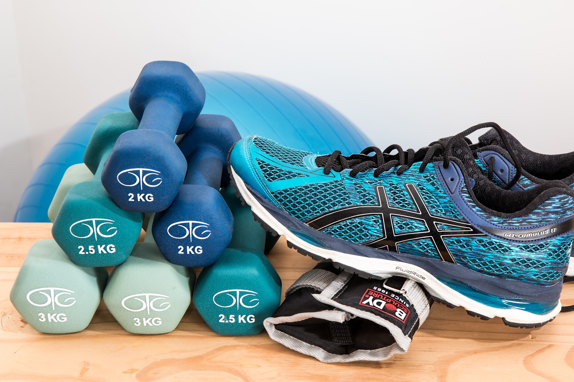 dumbbells and trainers